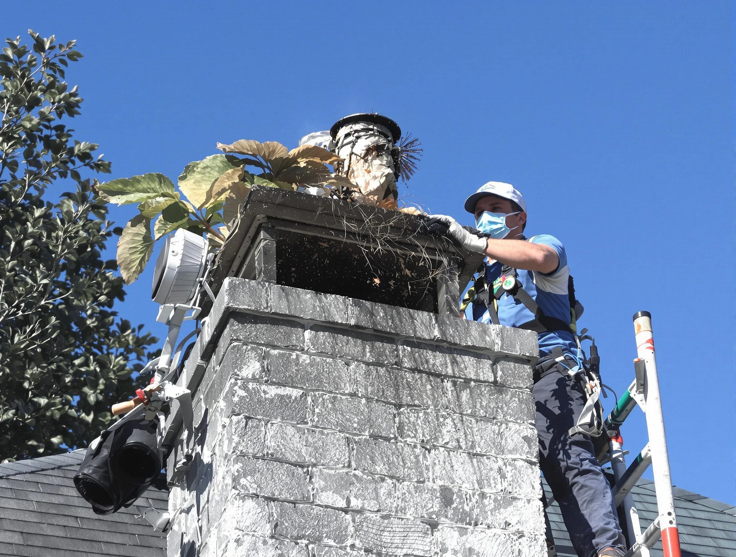 Freehold Chimney Sweep specialist performing chimney cleaning in Freehold, NJ