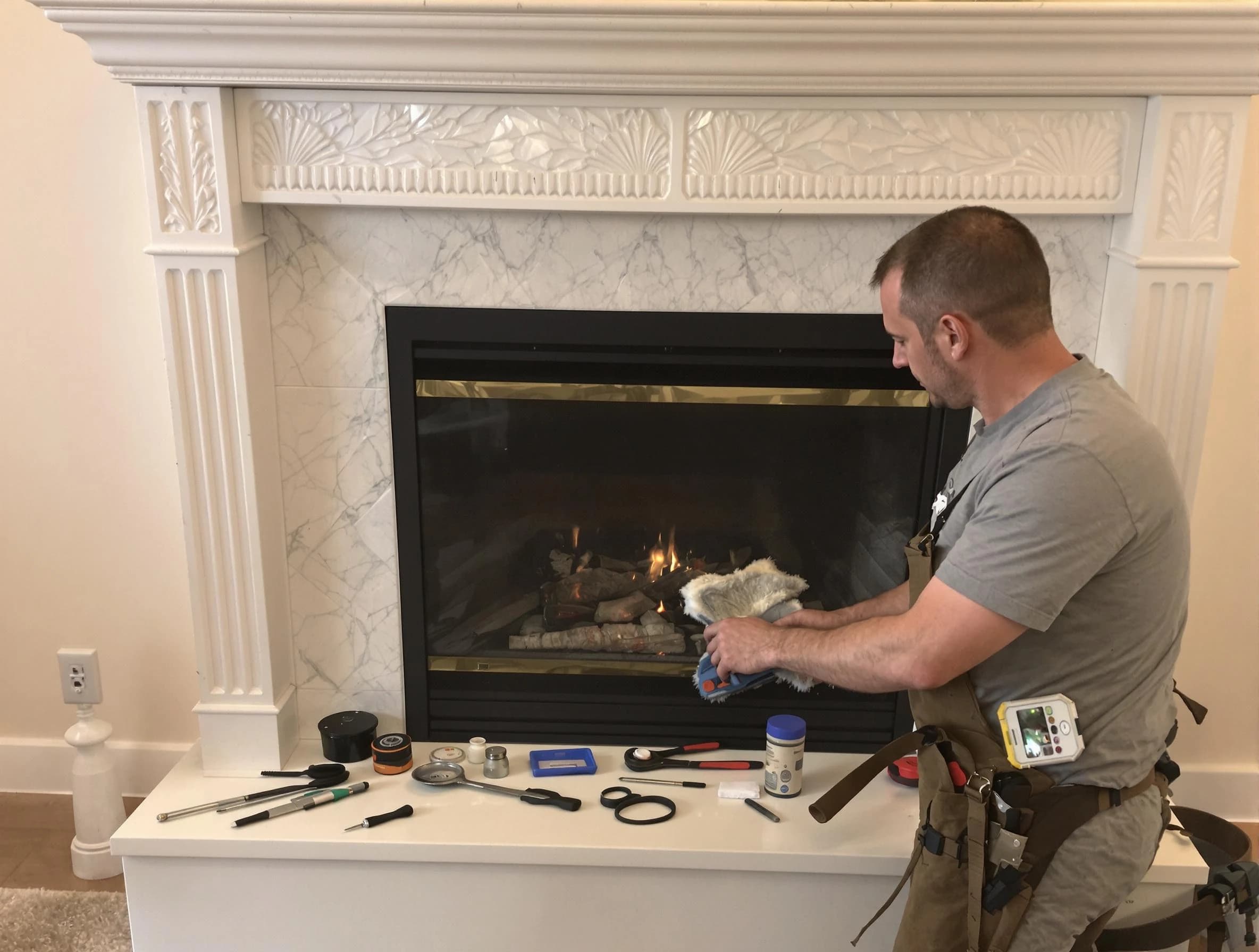 Freehold Chimney Sweep performing fireplace maintenance in Freehold, NJ